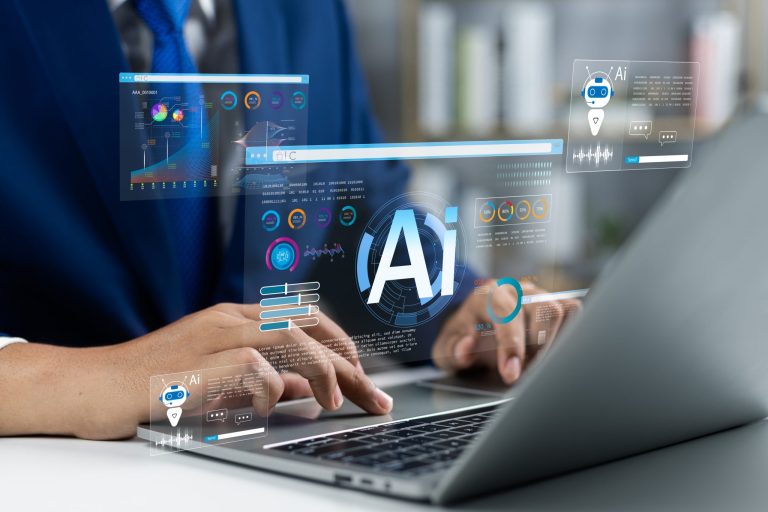 A hand typing on a keyboard with the text "AI" displayed above